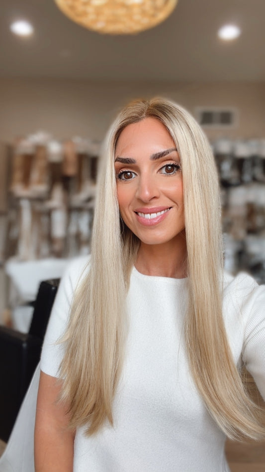 Juliana 21-inch light ash rooted blonde wig modeled by Jewell
