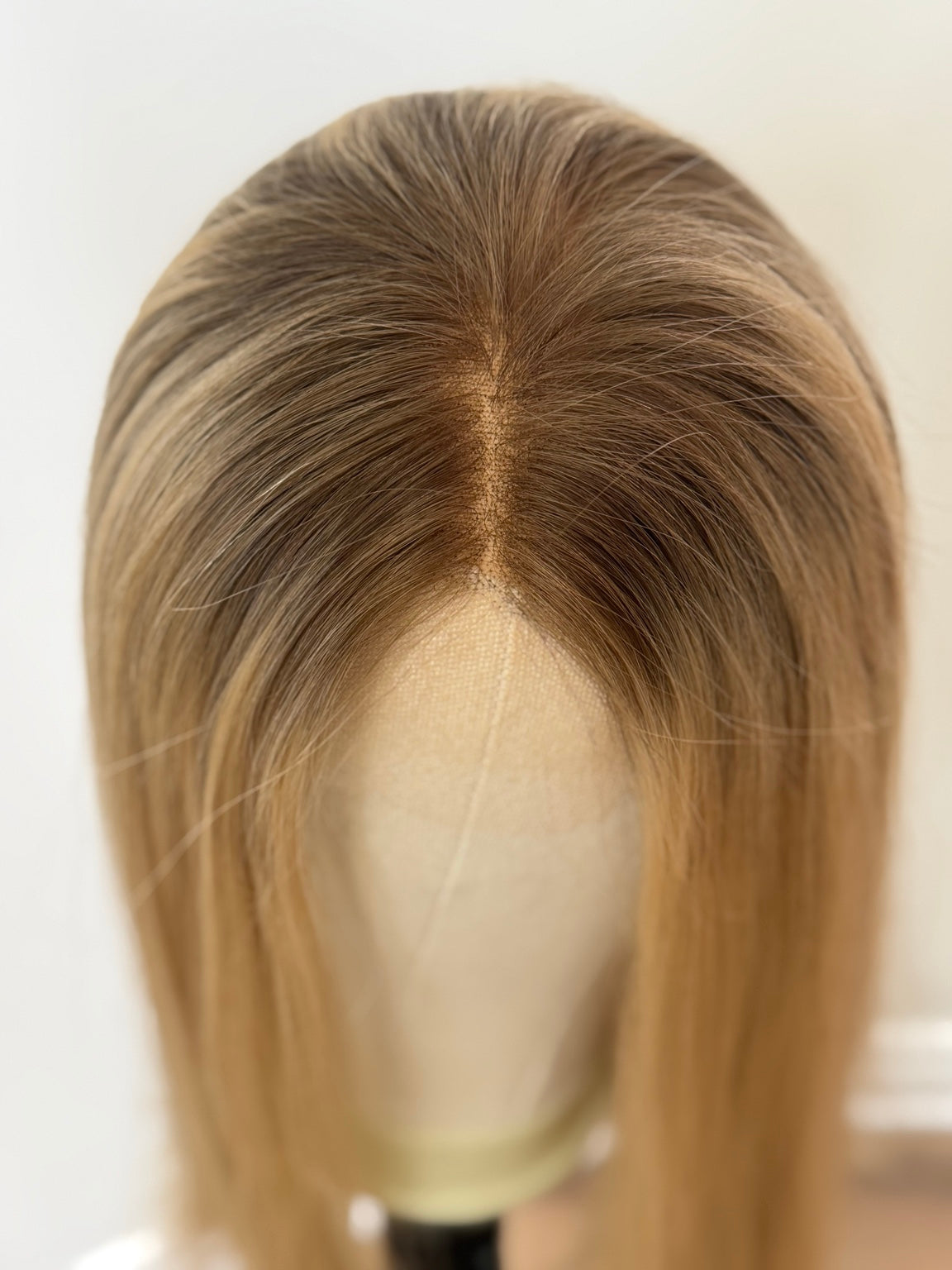 Juliana rooted blonde part and hairline close-up