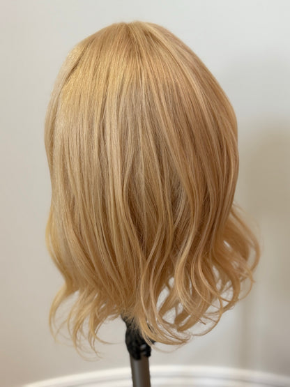 Monica wig back view styled in waves