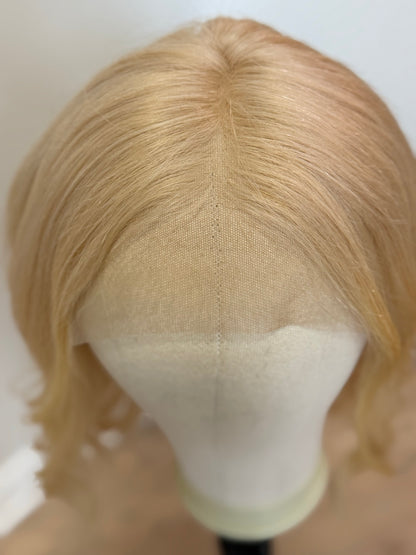 Monica platinum blonde part and hairline close-up
