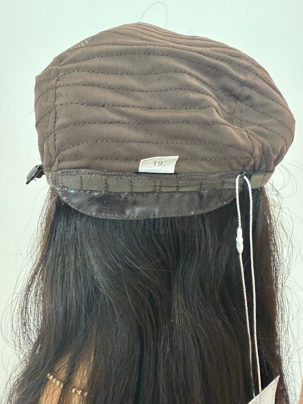 Terese dark brown wig with subtle peekaboo highlights, adjustable nape