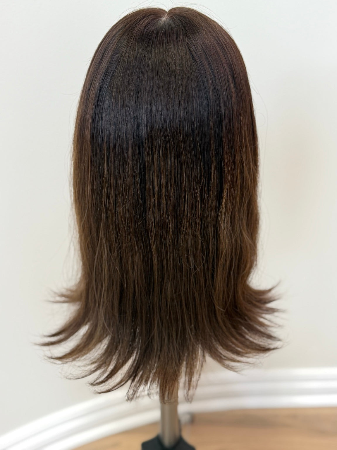 Terese dark brown wig with subtle peekaboo highlights, back