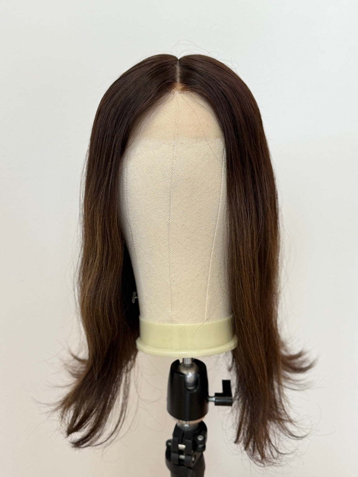 Terese dark brown wig with subtle peekaboo highlights, front