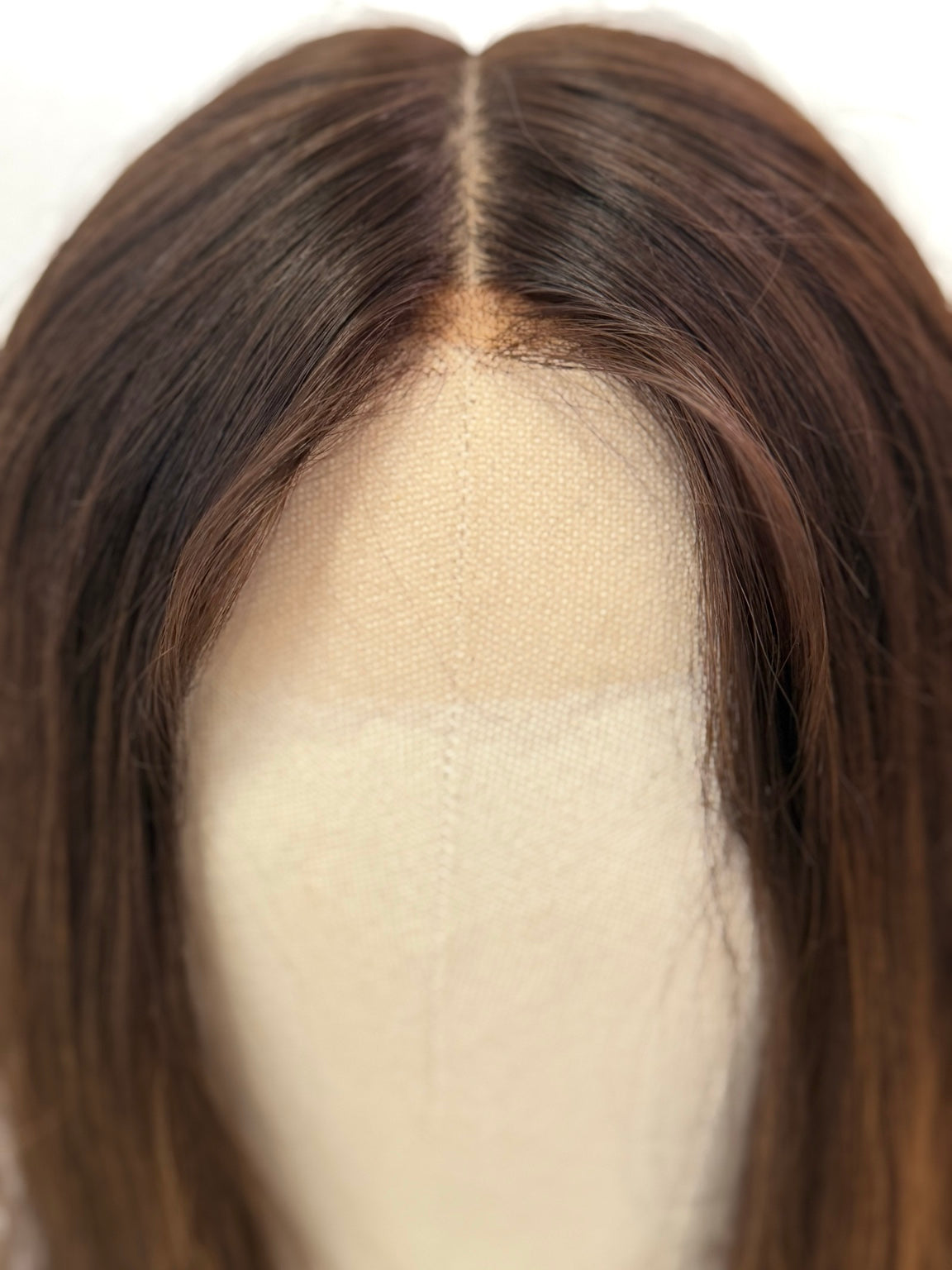 Terese dark brown wig with subtle peekaboo highlights, hairline