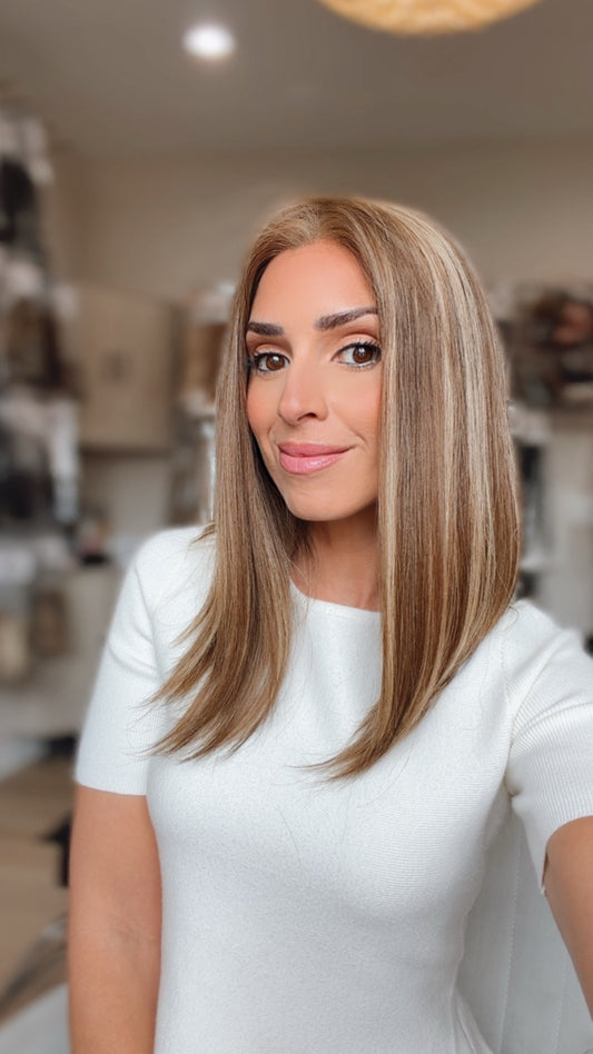 Victoria 16-inch light brunette wig with blonde highlights, model view